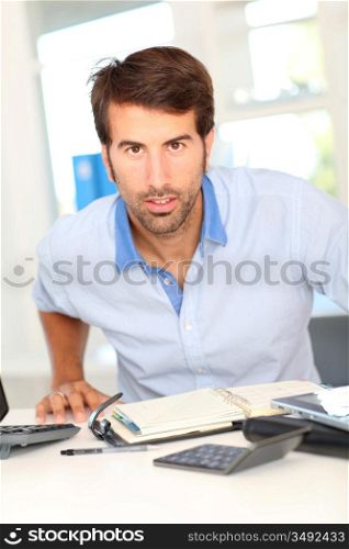 Office worker sitting at his desk