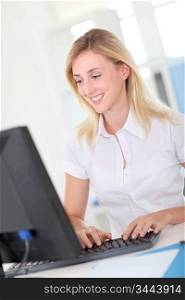 Office-worker sitting in front of desktop computer
