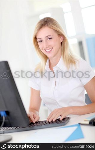 Office-worker sitting in front of desktop computer
