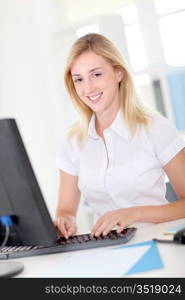 Office-worker sitting in front of desktop computer