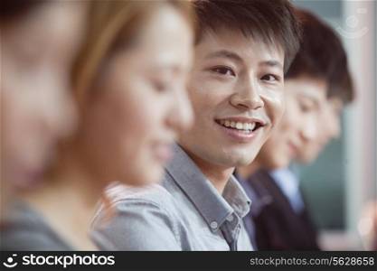 Office Worker Smiling and Looking at Camera