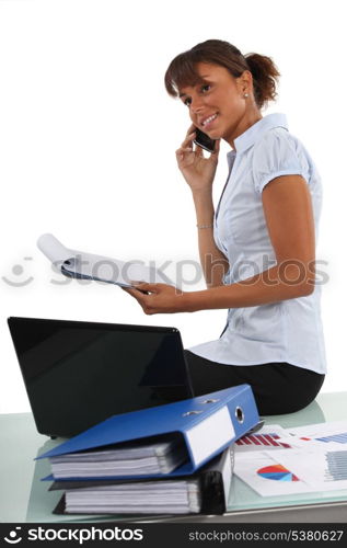 Office worker surrounded by paperwork