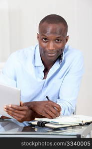 Office worker using electronic tablet at work