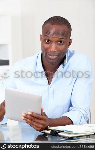 Office worker using electronic tablet at work