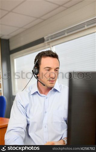Office worker wearing a headset