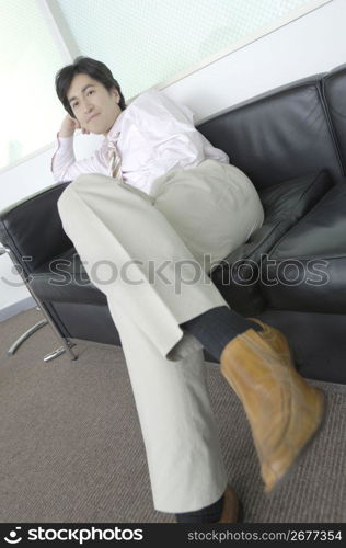 Office worker who relaxes with the sofa