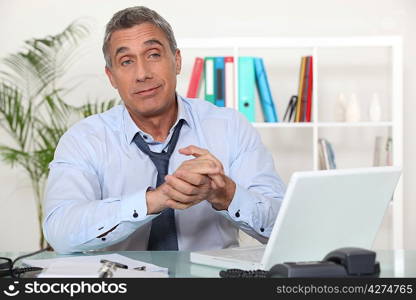 Office worker with clasped hands