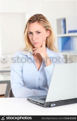 Office worker with doubtful look