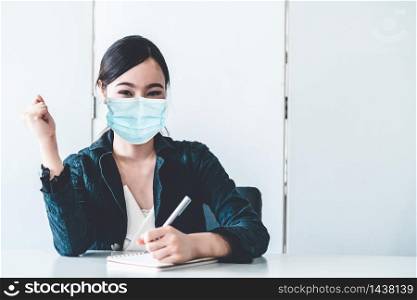 Office worker with face mask quarantine from coronavirus or COVID-19. Concept of protective working environment to reopen business and stop spreading of coronavirus or COVID-19.