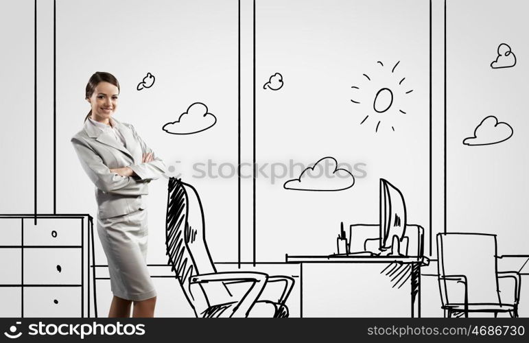 Office worker. Young confident businesswoman standing in drawn office