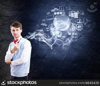 Office worker. Young handsome businessman in fumes smoking pipe