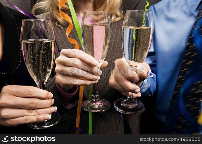 Office workers celebrating with champagne