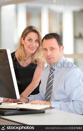 Office workers in front of computer