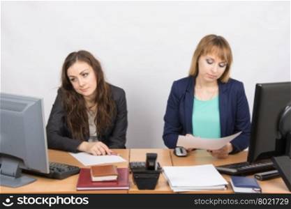Office Workers of despondently sitting at a desk