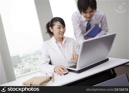 Office workers operating PC