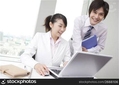 Office workers operating PC