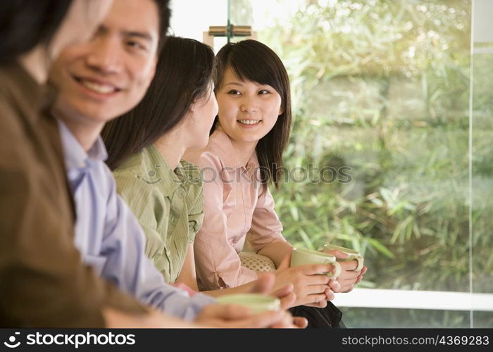 Office workers sitting side by side in an office