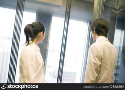 Office workers taking an elevator
