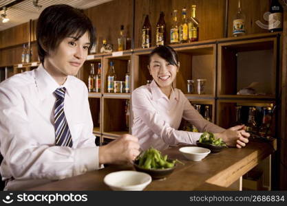 Office workers waiting for service at bar