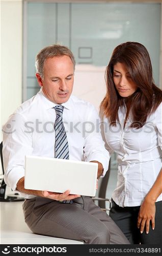 Office workers with laptop computer