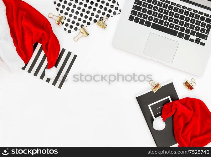 Office Workplace with Keyboard Laptop Computer and Christmas Decoration. Business Holidays Concept
