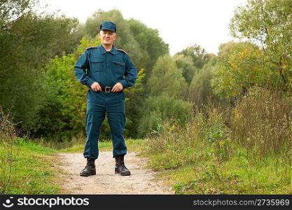 officer of rescue service standing on footpath outdoors
