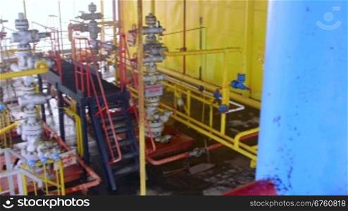 Offshore gas and oil production platform equipment series of pipes, gauges and valves pan shot
