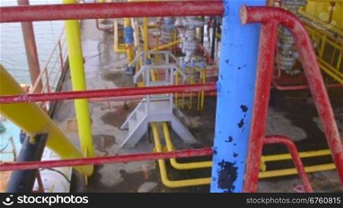 Offshore gas production platform components series of pipes, gauges and valves pan shot