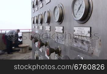 Offshore gas production platform equipment, in the background worker starts the generator