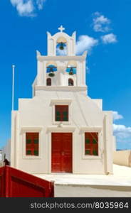 Oia. Greek church.. Traditional small white church in Oia on Santorini. Greece.