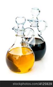 Oil and balsamic vinegar glass bottles isolated on white