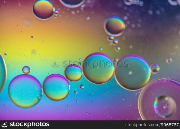 Oil drops in water. Abstract psychedelic pattern image multicolored. Abstract background with colorful gradient colors. DOF. Multicolored abstract background picture made with oil, water and soap