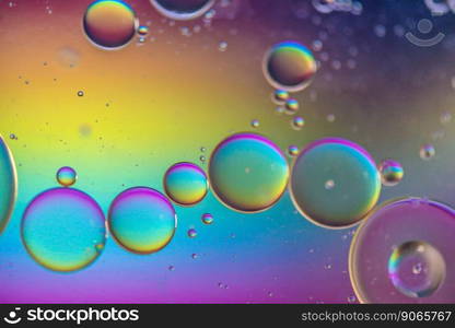 Oil drops in water. Abstract psychedelic pattern image multicolored. Abstract background with colorful gradient colors. DOF. Multicolored abstract background picture made with oil, water and soap