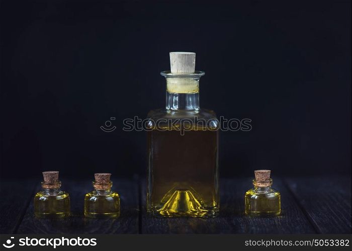 oil glass bottle. Oil glass bottles on a dark background