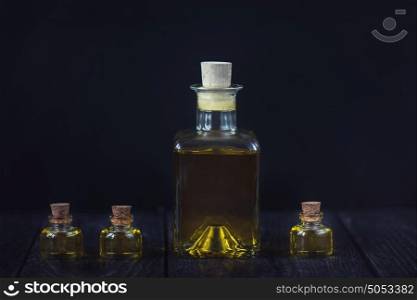 oil glass bottle. Oil glass bottles on a dark background