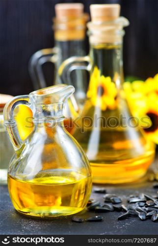 oil in bottle and on a table