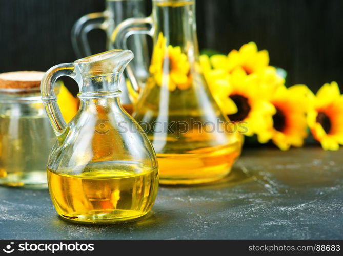 oil in bottle and on a table