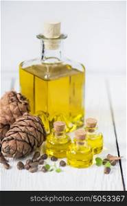Oil of cedar nuts. Oil of cedar nuts on a white wooden background
