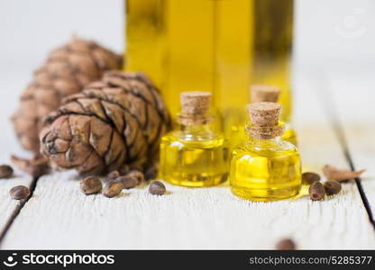 Oil of cedar nuts. Oil of cedar nuts on a white wooden background