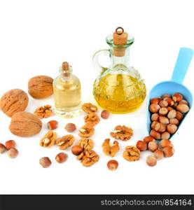 Oil of walnut and hazelnut, nut fruit isolated on white background. Flat lay,top view.