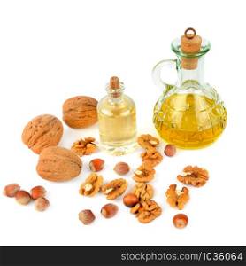 Oil of walnut and hazelnut, nut fruit isolated on white background. Organic healthy food.