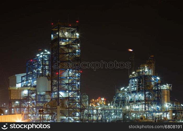 Oil refinery industrial plant at night, Thailand