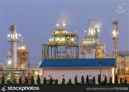 Oil refinery plant from industry, petrochemical oil and gas refinery and pipeline industry with sunrise sky background