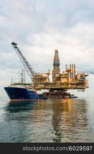 Oil rig platform in the calm sea