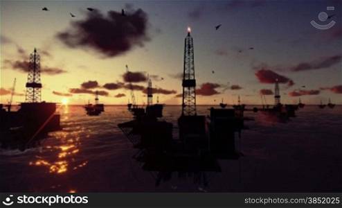 Oil rigs in ocean, timelapse sunrise, helicopter view