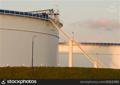 Oil tanks in the warm glow of the evening light