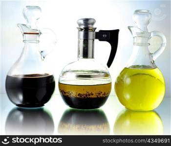 oil , vinegar and salad dressing bottles