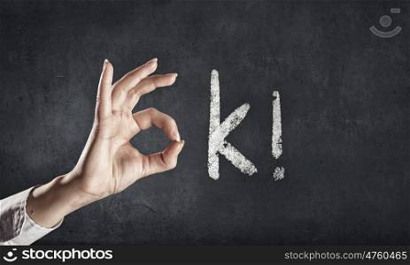 Ok gesture. Hand showing ok gesture as part of word