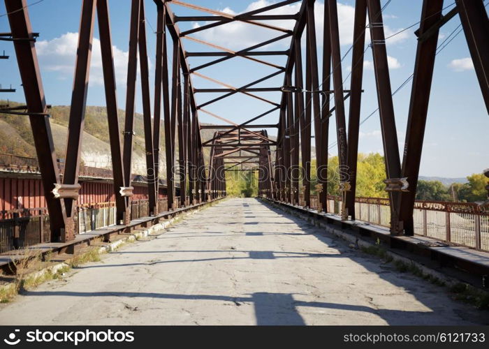 Old abandoned bridge on the river