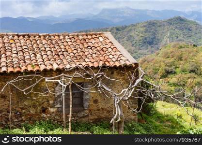old abandoned country house in Sicilian mountains in spring